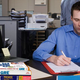 Illustration for article titled Frustrated Employee No Longer Even Trying To Hide GRE Study Books